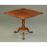 A Georgian walnut tripod table, with shaped top,