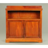 An Edwardian mahogany bookcase, with rear upstand, single shelf,