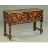 A late Victorian oak Jacobean style dresser base,