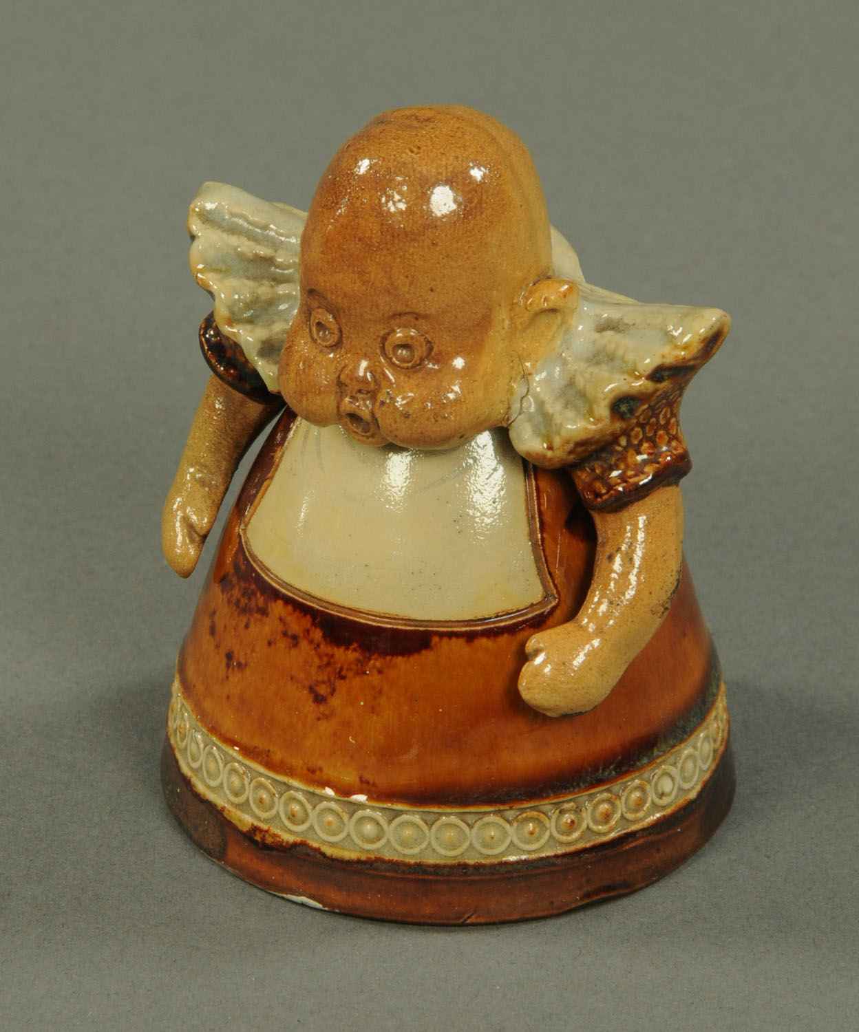 A Royal Doulton Suffragette figure, in the form of a baby, impressed marks to base.