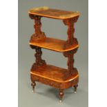 A Victorian inlaid walnut three tier whatnot stand, with pierced brass gallery,