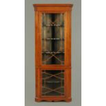 An Edwardian inlaid mahogany standing corner cupboard,