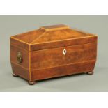 A Regency mahogany tea caddy, with centre aperture and two caddies,