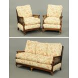 A Three piece Bergere lounge suite, with mahogany frame, loose cushions,