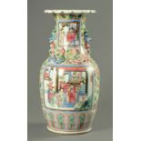 A Cantonese vase, with flared lip and decorated in typical Canton colours with panels of figures.