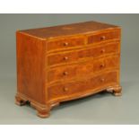 A walnut veneered serpentine chest of drawers, circa 1930,