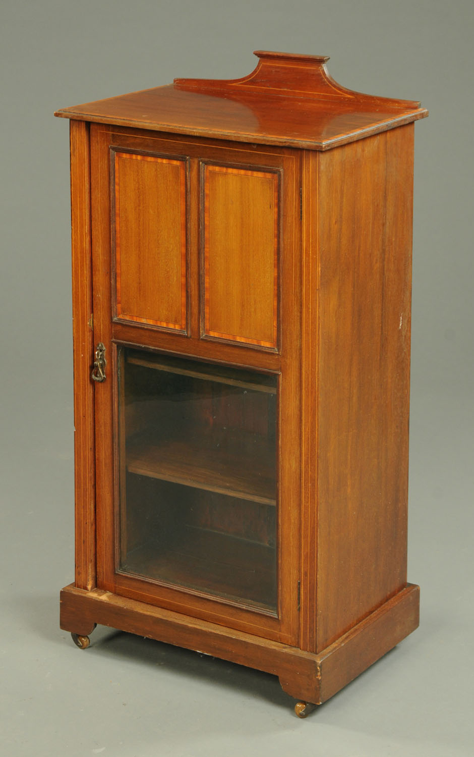 An Edwardian inlaid mahogany music cabinet,