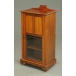 An Edwardian inlaid mahogany music cabinet,