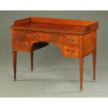 An Edwardian George III style mahogany dressing table, with three quarter gallery,