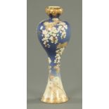 A 19th century Japanese Meiji period vase, foliate patterned to blue ground. Height 36 cm.