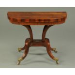 A Regency rosewood card table, with turnover top, reeded frieze, four supports,