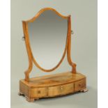 A George III mahogany toilet mirror, shield shaped,