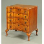 A walnut Queen Anne style inverted breakfront chest of drawers, circa 1930, raised on cabriole legs.