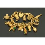 A 9 ct gold charm bracelet, fourteen charms and padlock, 39.3 grams gross (see illustration).