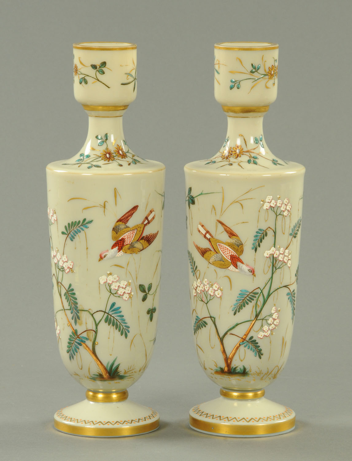 A pair of Victorian glass vases, decorated with birds and flowers. Height 34 cm (see illustration).