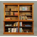 A Victorian walnut library open bookcase, in two sections,