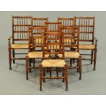 A set of two carver arm and six single Lancashire style spindle back rush seated dining chairs (see