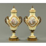 A pair of Edwardian Sevres style porcelain lidded vases, with metal mounts, signed "P. Phillipot.