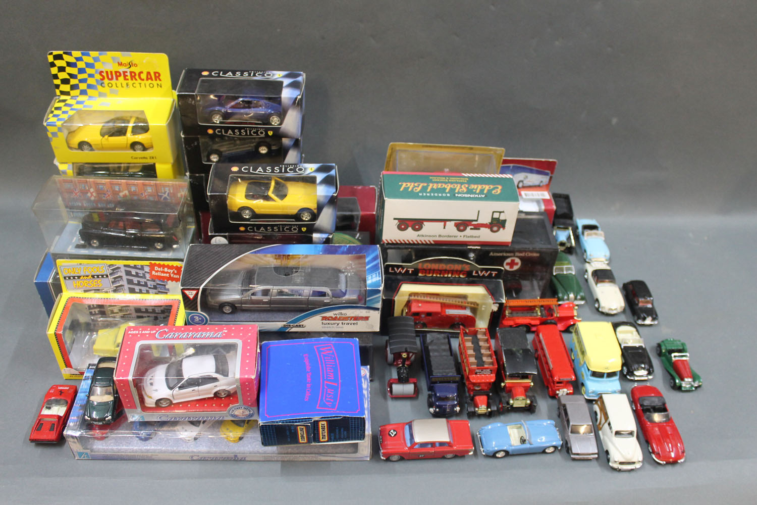 A box of miscellaneous boxed diecast model vehicles and a collection of unboxed diecast model