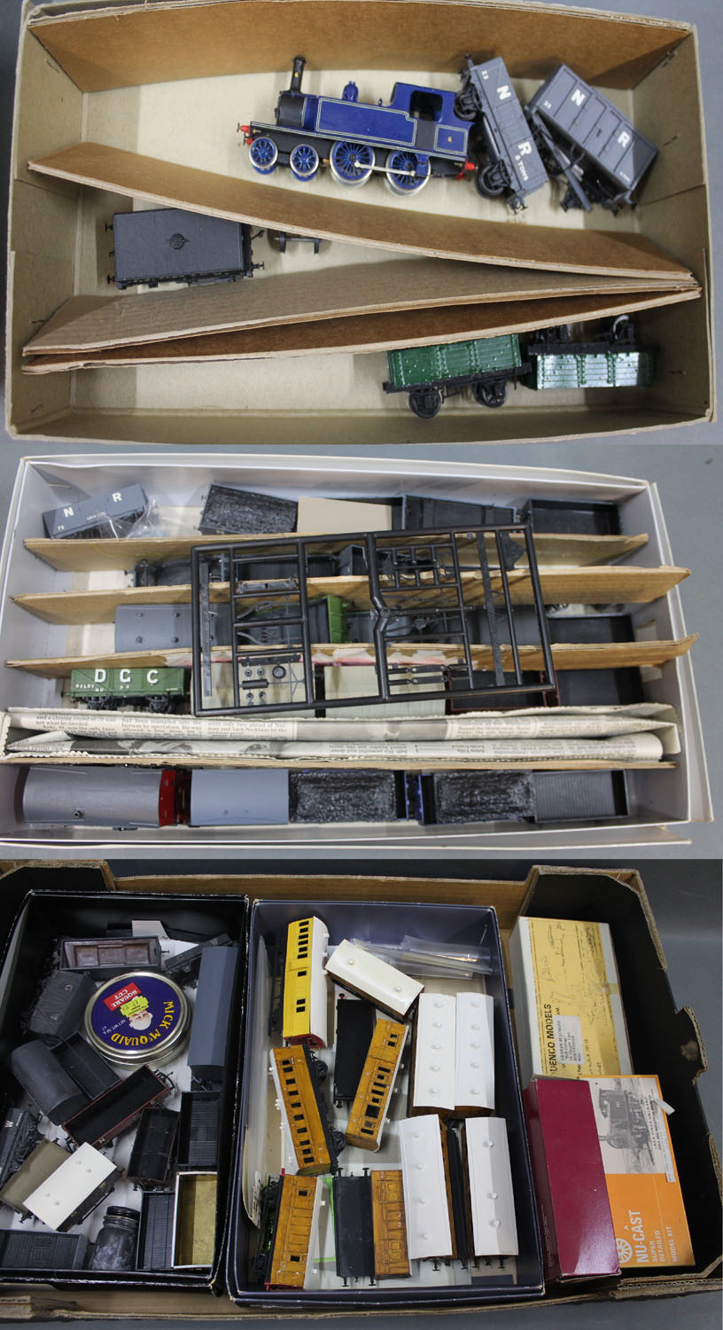 A box of kit built rolling stock and locomotives including NU-Cast