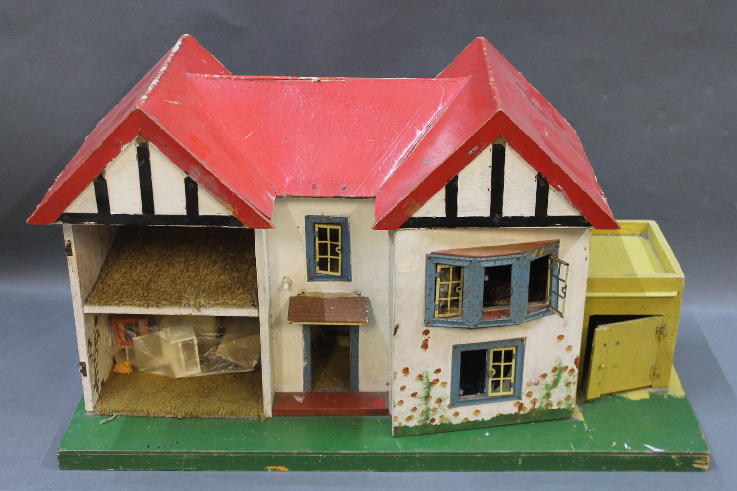 A wooden Tudor style dolls house