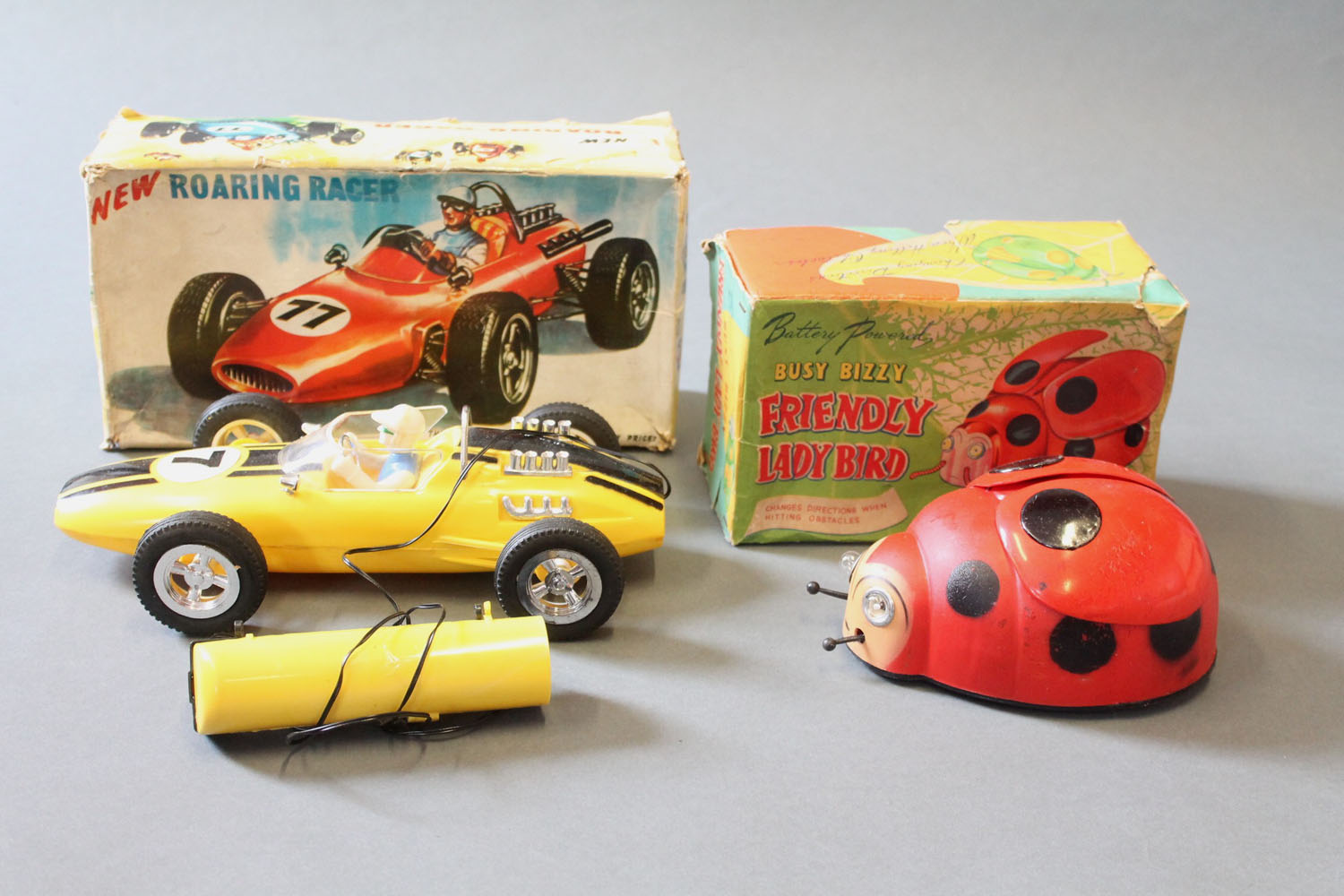 2 1960's battery operated toys: "Roaring Racer" racing car & "Busy Bizzy friendly ladybird"