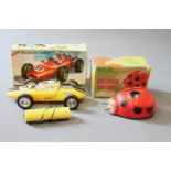 2 1960's battery operated toys: "Roaring Racer" racing car & "Busy Bizzy friendly ladybird"