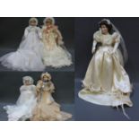 A group of 4 boxed "The Ashton-Drake Galleries" porcelain dolls and a porcelain bride doll