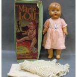 A boxed Mormit plastic "Marie Lou" feeding and wetting doll