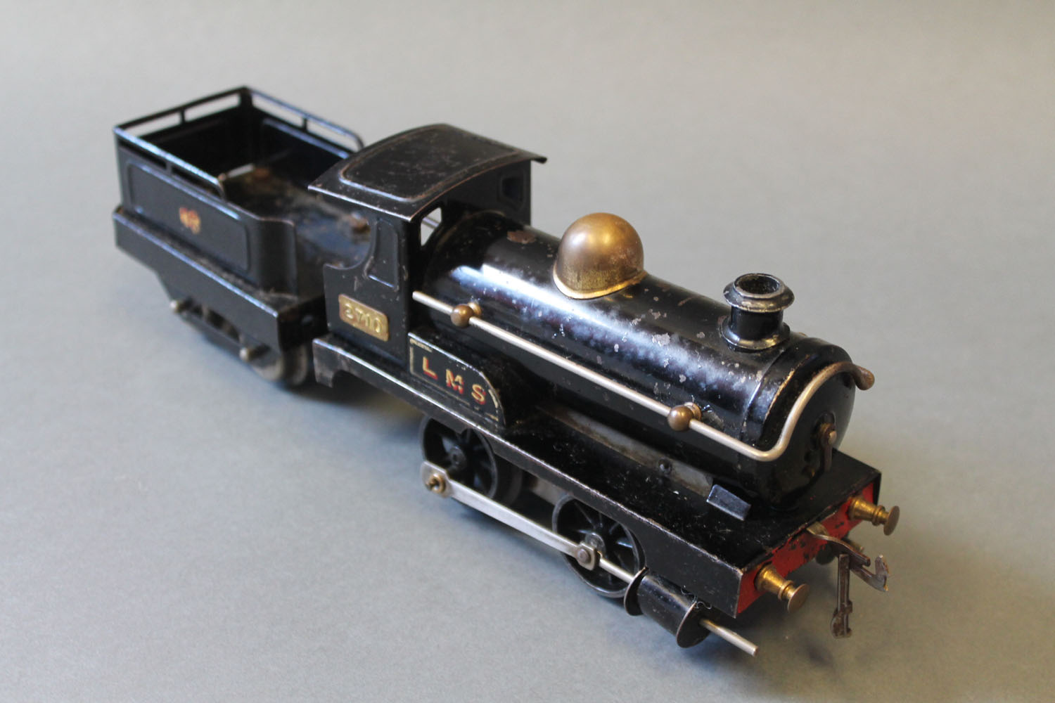 A Hornby 0 gauge 0-4-0 LMS locomotive and tender, 2710,