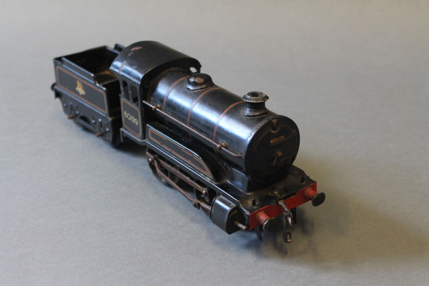 A Hornby 0 gauge clockwork type 50 0-4-0 locomotive and tender, 60199,