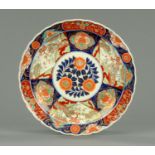 A 19th century Imari charger, decorated in typical Imari colours. Diameter 37 cm.