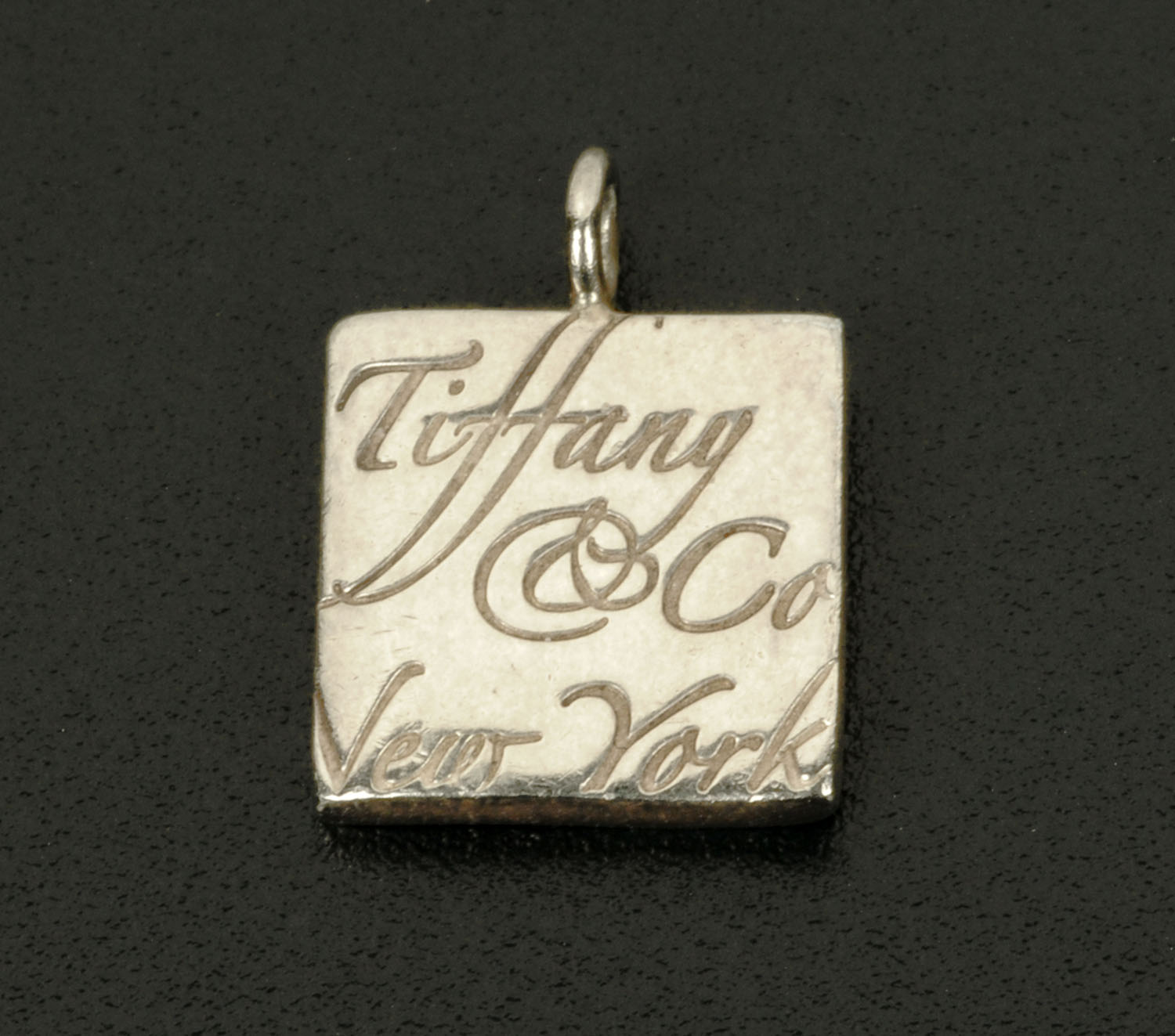 A small Tiffany & Co. of New York book form charm.