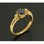 An 18 ct yellow gold sapphire and diamond ring, size L/M.