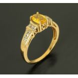 A 9 ct yellow gold yellow sapphire and diamond ring, size O.