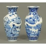 A pair of 19th century Japanese blue and white dragon vases. Height 30 cm.