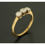 A 9 ct yellow gold three stone diamond ring, size L/M.