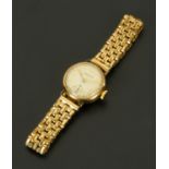 A 9 ct gold cased Marvin ladies wristwatch, with plated bracelet.