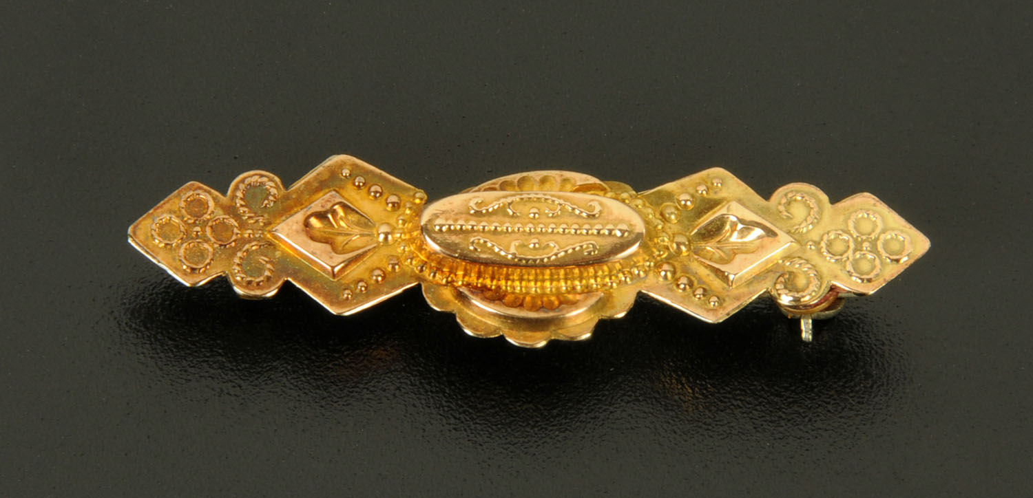 A 9 ct gold bar brooch, 2 grams.