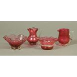 Four pieces of 19th century cranberry glass. Tallest 10 cm.