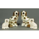 A pair of 19th century Staffordshire dogs, with lustre decoration, height 23 cm, and a smaller pair.