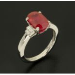 An 18 ct white gold oval ruby and baguette diamond shoulder ring, ruby weight +/- 3.