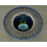 A Tobias Harrison blue and gilt Studio Pottery bowl. Diameter 41 cm.