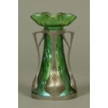 An Art Nouveau Loetz style green glass vase, with stylised metal mounts. Height 19 cm.