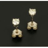 A pair of 18 ct white gold stud earrings, set with diamonds weighing +/- .38 carats.