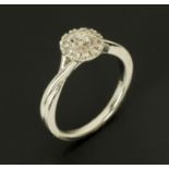 A 9 ct white gold diamond cluster ring, size J/K.