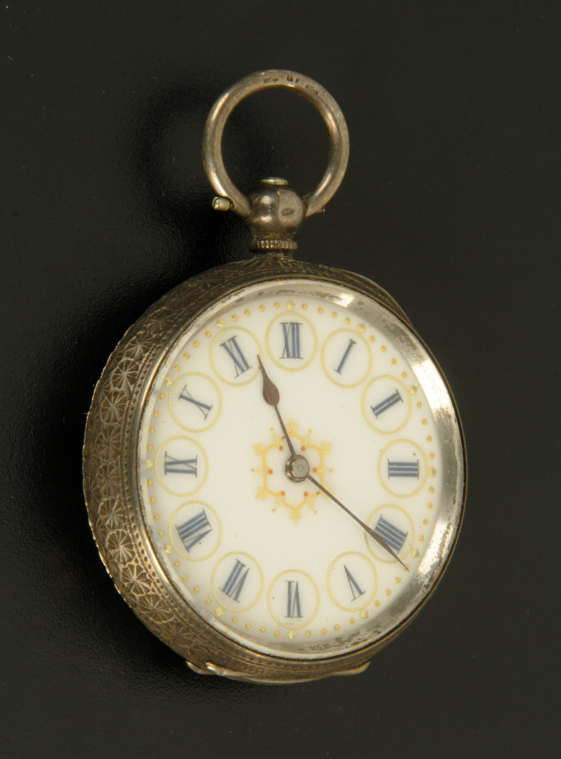 A late 19th century Continental silver coloured fob watch, foliate engraved, the case stamped "935".