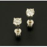 A pair of 18 ct white gold stud earrings, set with diamonds weighing +/- .