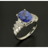 WITHDRAWN - An 18 ct white gold tanzanite and diamond shoulder ring, size N (see illustration).