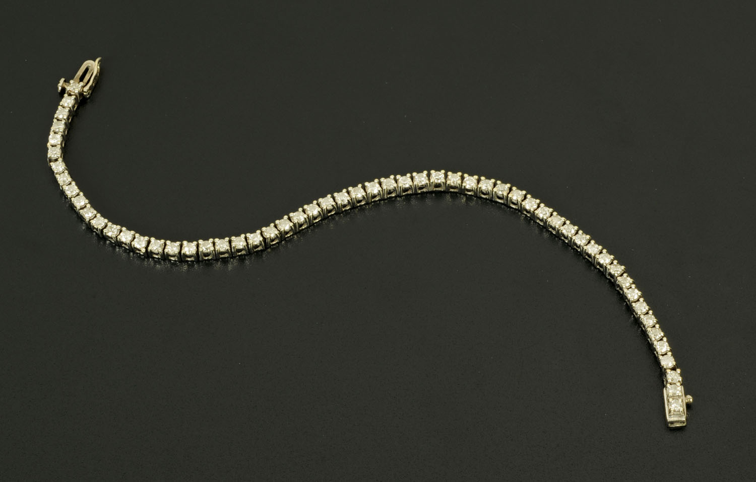 WITHDRAWN - A 9 ct gold tennis bracelet, length 18 cm,